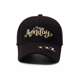Classic black cotton baseball cap with gold Monday and zzz embroidery in front view