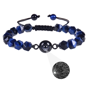 Detailed view of faceted tiger eye beads and 100 languages I Love You projection effect