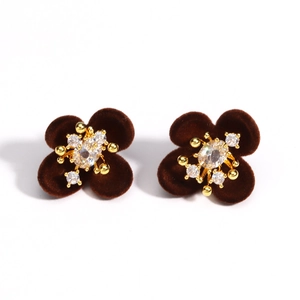 Elegant burgundy velvet flower earrings with golden crystals on a clean white background