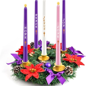Detail of Christmas Advent wreath with five candles featuring Hope Peace Joy Love Jesus text