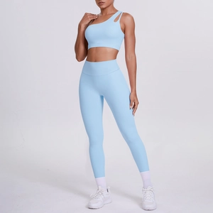 Detail of light blue one-shoulder sports bra and high-waist yoga leggings set