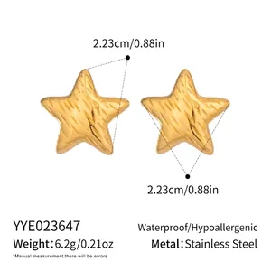 Detailed view of textured gold star studs in stainless steel with weight and size data