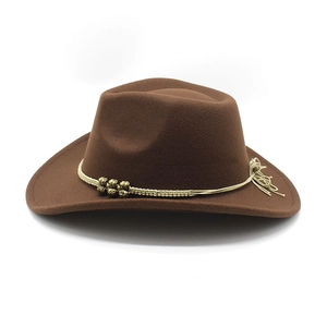 Detail of brown felt cowboy hat featuring woven trim and decorative metal beads