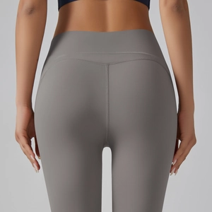 Macro detail of high-waist yoga pants with V-shaped rear seam for butt lifting effect