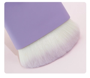 Detailed close-up of soft white bristles on a flat head purple makeup brush tool