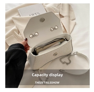 Internal view of the white sequin shoulder bag showing capacity for phone and wallet