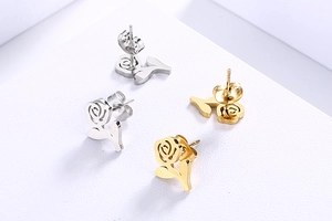 Detailed view of elegant rose flower stud earrings in gold and silver finish