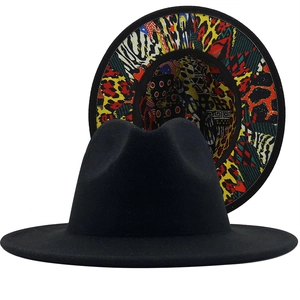 Classic black wool fedora hat with vibrant leopard print and graffiti lining on the wide brim
