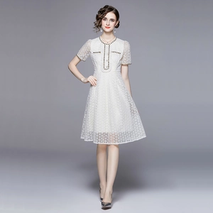 Elegant white French style lace midi dress with chic gold weave trim and A-line silhouette