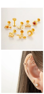 Detailed set of gold titanium labret studs featuring zircon heart, snake and crown designs