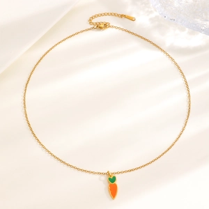 Detailed macro view of carrot pendant necklace with enamel finish and lobster clasp