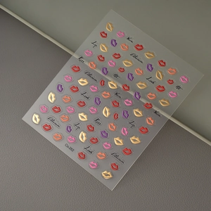 Detailed view of sexy lip nail art stickers with gold foil and various romantic words
