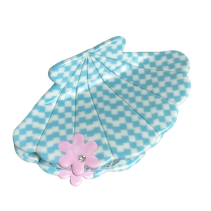 Checkerboard shell-shaped acetate hair claw clip with pink rhinestones and floral details