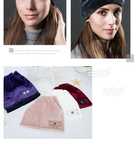 Detail of velvet winter hats for women featuring elegant rhinestone bow decorations