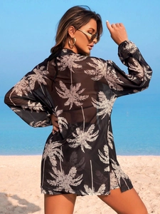 Cache-maillot noir femme avec imprimé palmier blanc en maille transparente de plage