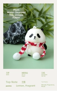 Panda scented candle with red scarf, featuring notes of tea, jasmine, and musk