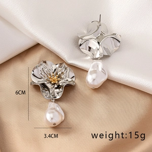 Detail of silver floral earrings with pearl drop showing dimensions 6cm by 3.4cm