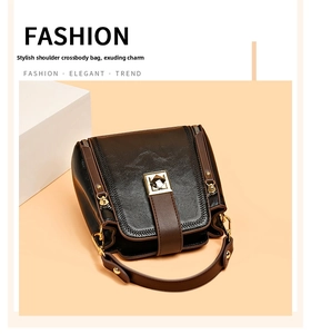 Detail of contrast color bucket bag showing the faux leather texture and metallic closure