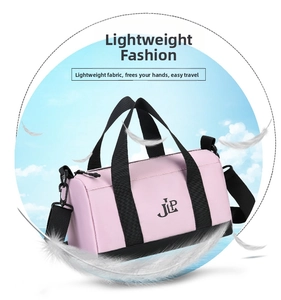 Detailed view of lightweight pink nylon cylinder duffel bag with black JLP branding and straps