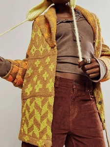 Macro detail of retro knit texture and two-tone vintage pattern on casual cardigan