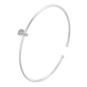 Detail of minimalist copper cuff bracelet with pavé-set zircon alphabet letter charm