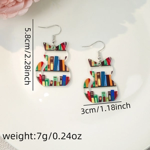 Detail of acrylic cat earrings with colorful book patterns, dimensions 5.8cm by 3.0cm