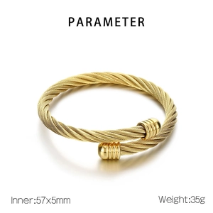Detail showing 5mm wide golden twisted cable cuff bracelet with size and weight info
