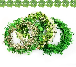 Close-up of green and gold shamrock tinsel garland for St. Patrick's Day garden decor