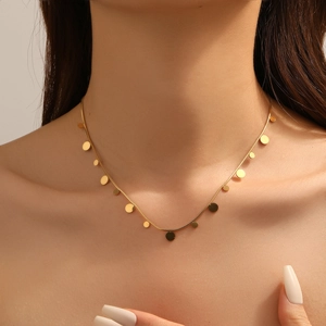 Elegant gold minimalist necklace featuring small round disc pendants for women