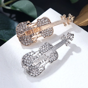 Squisite spille a violino in oro e argento con strass scintillanti incastonati