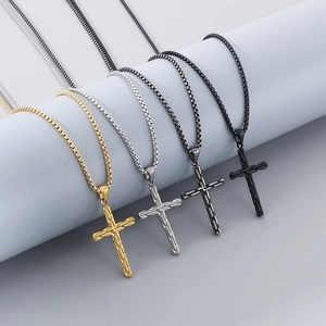 Detailed comparison of cross pendants in gold, silver, dark grey, and black stainless steel