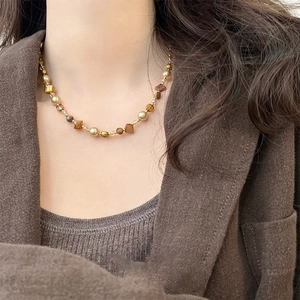 French style 18K gold plated tiger eye beaded necklace worn on neck by a model