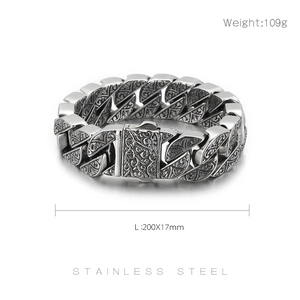 Macro view of vintage engraved patterns on silver stainless steel men's bracelet