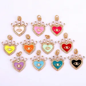 Set of 11 colorful enamel crown heart pendants with evil eye zircon in gold plating