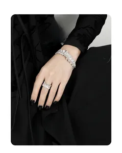 Detailed view of silver textured irregular ring and cuff bracelet set for women