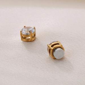 Detail view of gold magnetic zircon stud earrings showing the back magnet structure