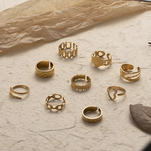 9-piece set of adjustable gold stainless steel rings with vintage textures and heart motifs