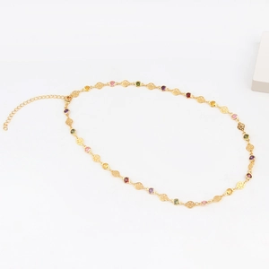 Close-up of gold-plated chain necklace with colorful micro-pave cubic zirconia crystals