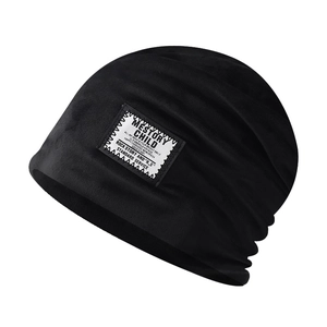 Women's black chenille knit beanie hat with vintage logo patch for winter warmth