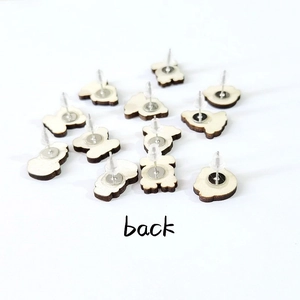 Back view of autumn wood stud earrings with silver needles on white background