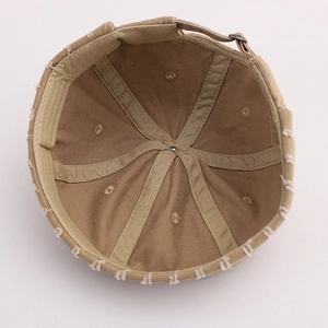 Detail view of khaki cotton docker hat interior featuring reinforced six-panel stitching
