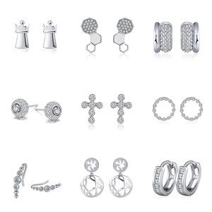 Macro display of nine silver 925 earrings with sparkling cubic zirconia stones