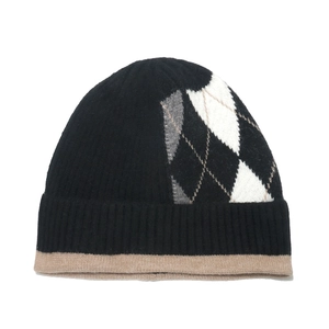Close-up of knit beanie with argyle pattern and wide ribbed cuff with khaki edge