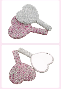 Detail view of heart-shaped handheld mirrors with sparkly rhinestones in silver and pink