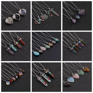 Detailed grid of crystal pendant necklaces in heart, hexagonal, and teardrop shapes