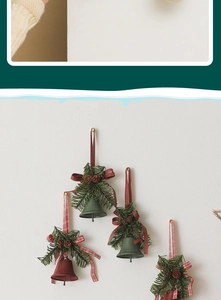 Close-up of Christmas bells with pine cones and plaid ribbons hanging on a white wall