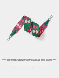 Detail of 5cm wide green woven shoulder strap with leather ends and silver metal hooks