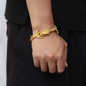 Detailed close-up of golden dragon bracelet showing scales and 18k gold plated textures