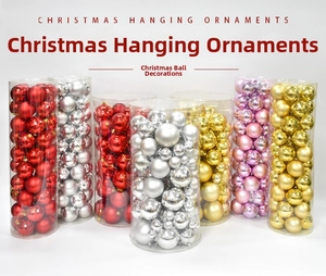 Detailed set of matte, glossy, and faceted Christmas ornaments in cylindrical packaging