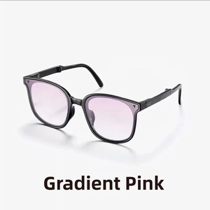 Detailed view of foldable sunglasses featuring gradient translucent pink lenses and black frames